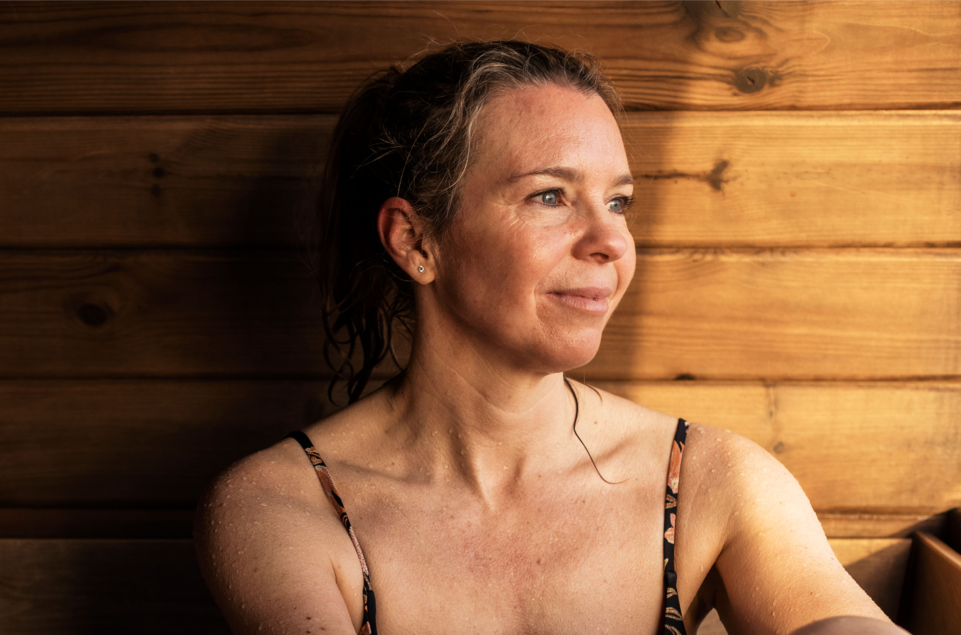 Woman sitting in sauna