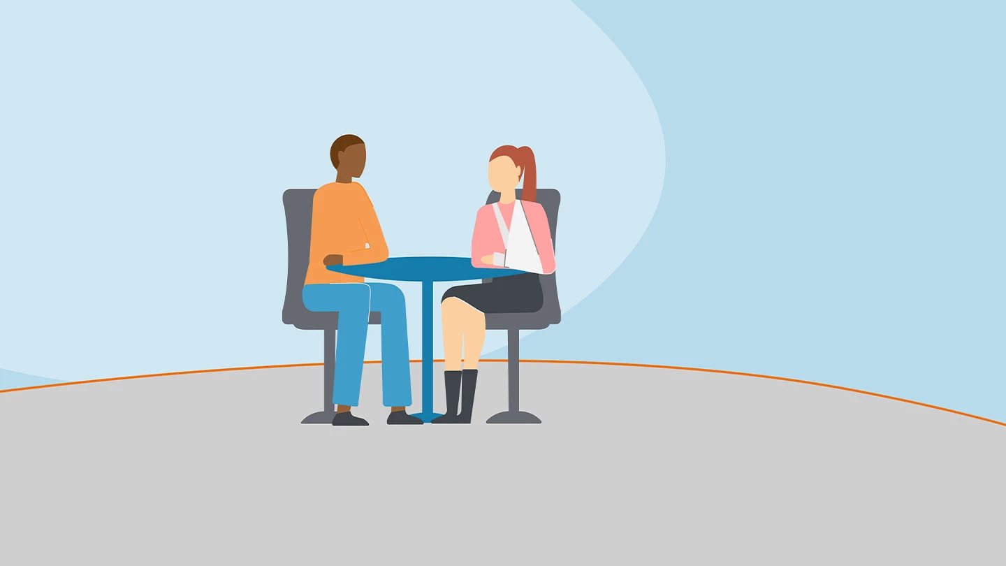 Twee zorgprofessionals voeren het goede gesprek bij verzuim.
