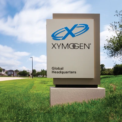 XYMOGEN's headquarter sign overlooking the main building